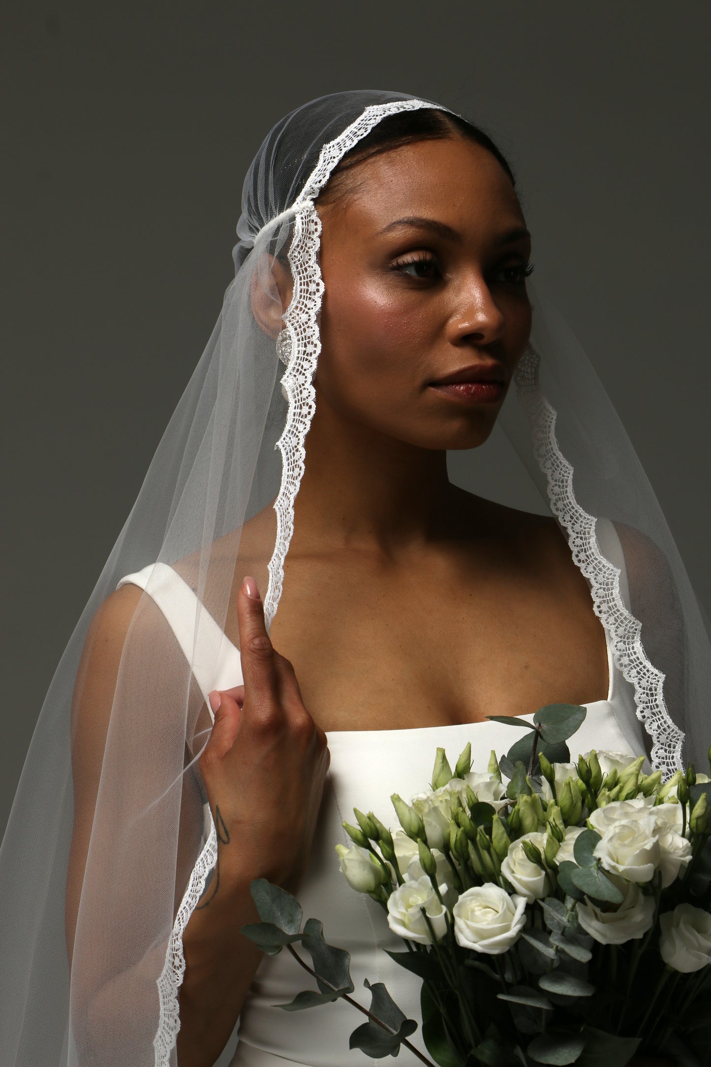 Handmade cathedral veil with fine lace edging detail.