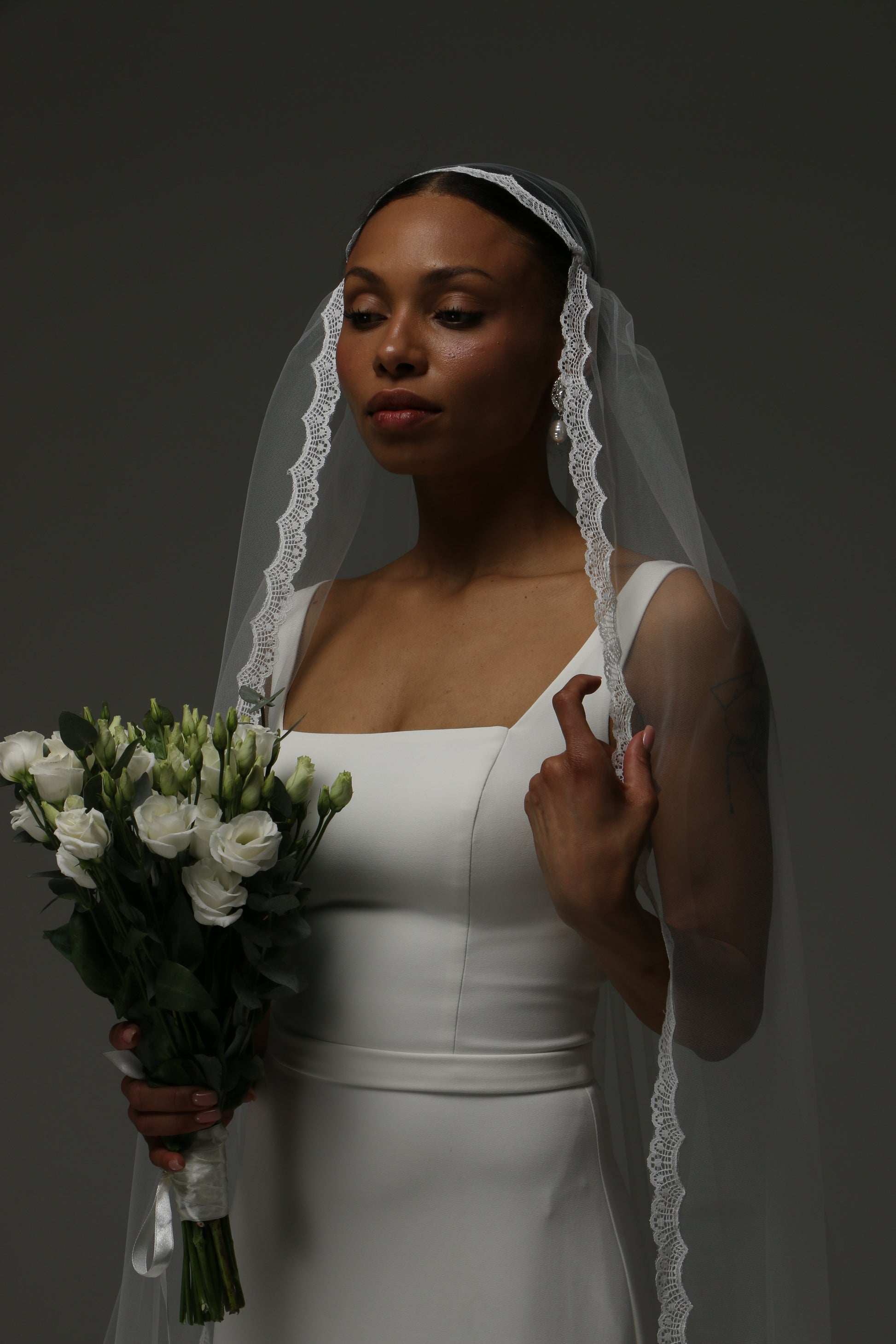 Classic Juliet cap veil designed for timeless bridal style.