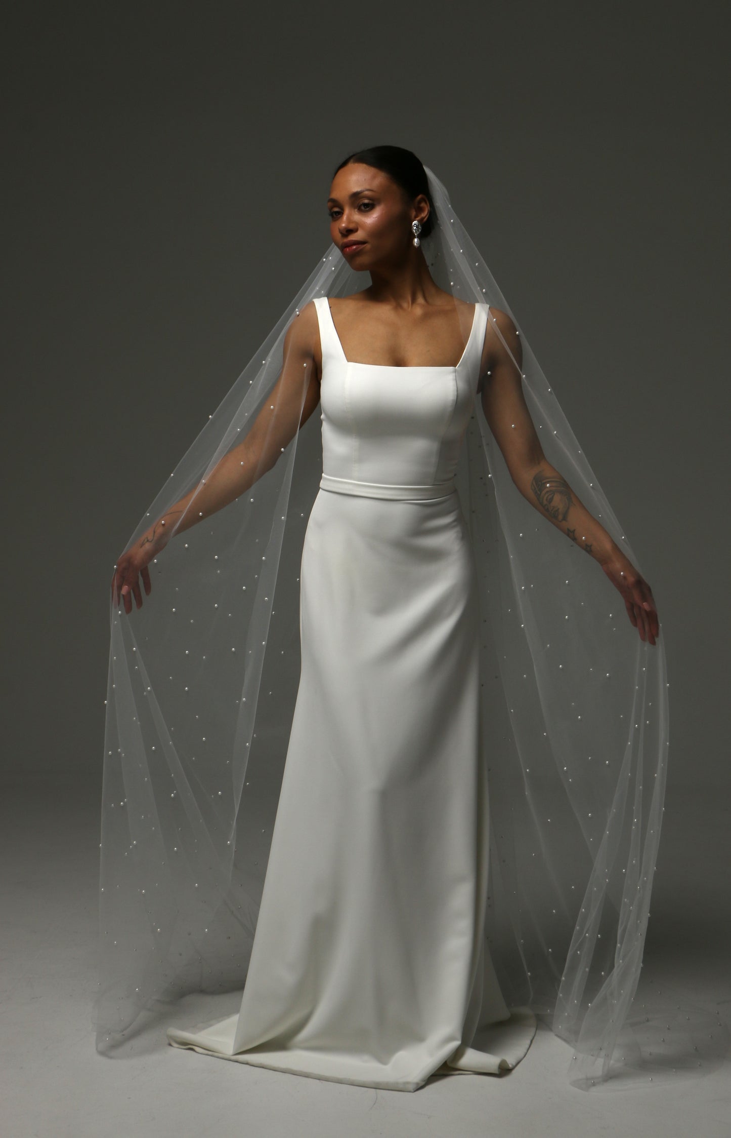 Elegant cathedral pearl veil with delicate hand-applied pearl accents.