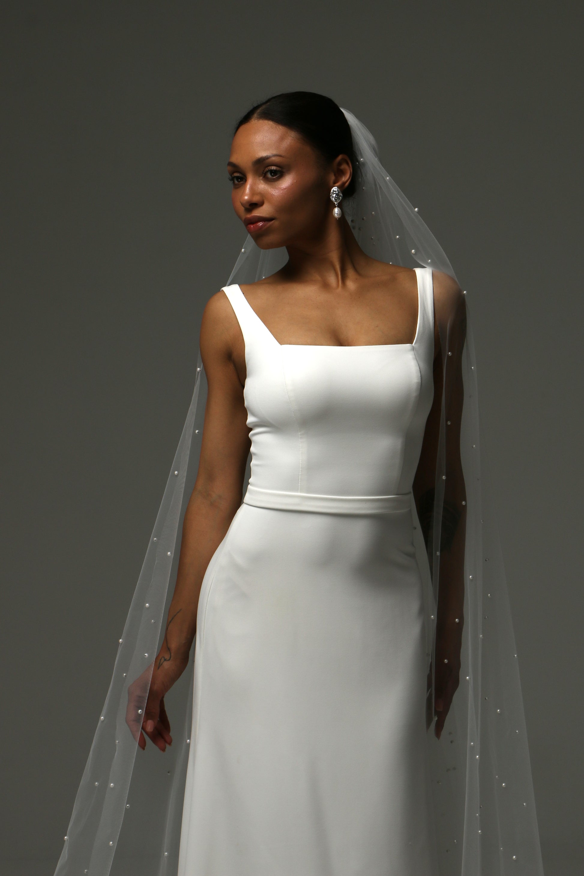 Luxury pearl wedding veil crafted from lightweight soft tulle.