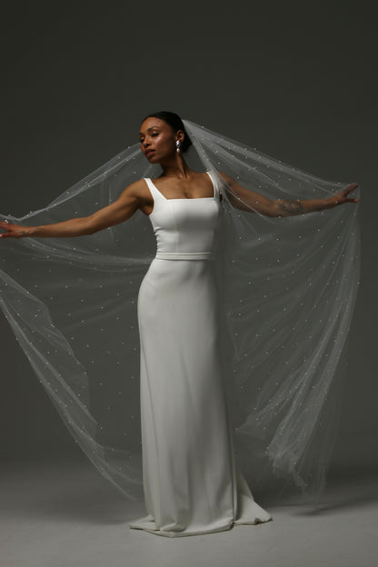 Cathedral pearl veil styled with a sleek satin wedding dress.