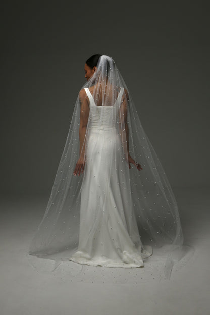 Lightweight cathedral-length veil with evenly scattered pearls.