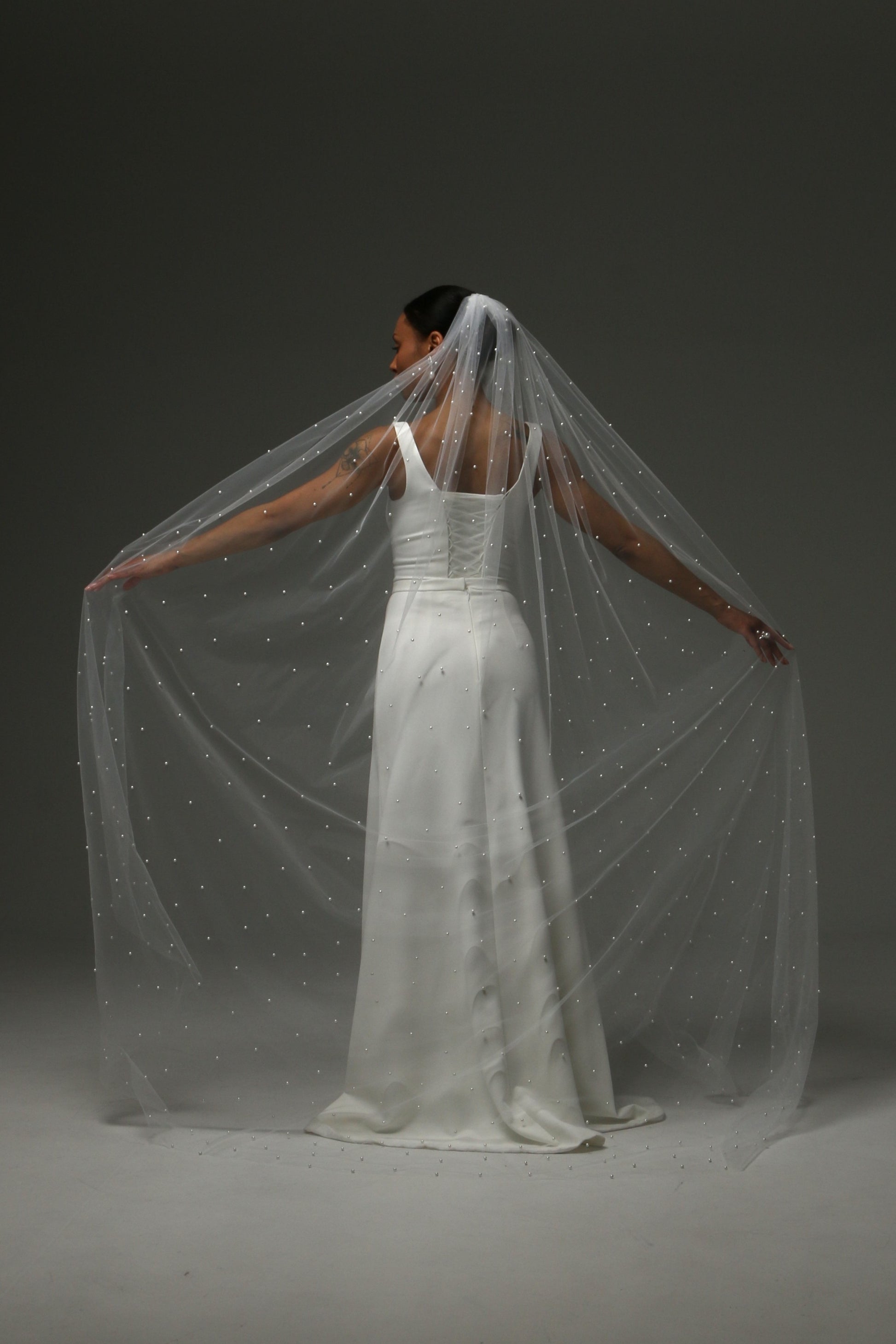 legant wedding veil with soft tulle and subtle pearl shimmer.