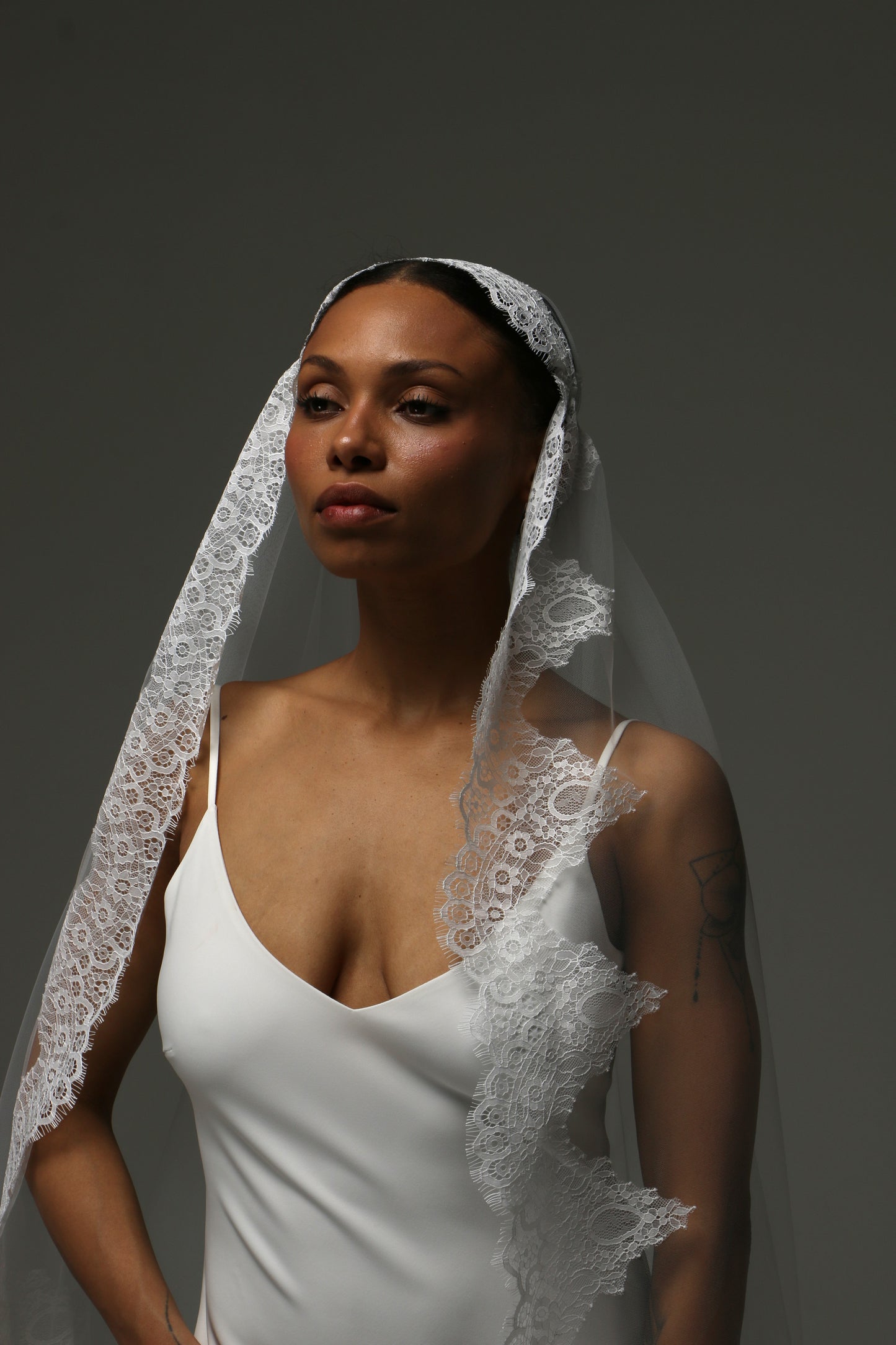 Soft ivory tulle veil with luxurious lace edging.