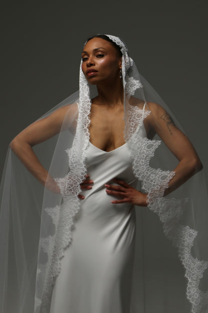Classic mantilla-style wedding veil for timeless bridal elegance.