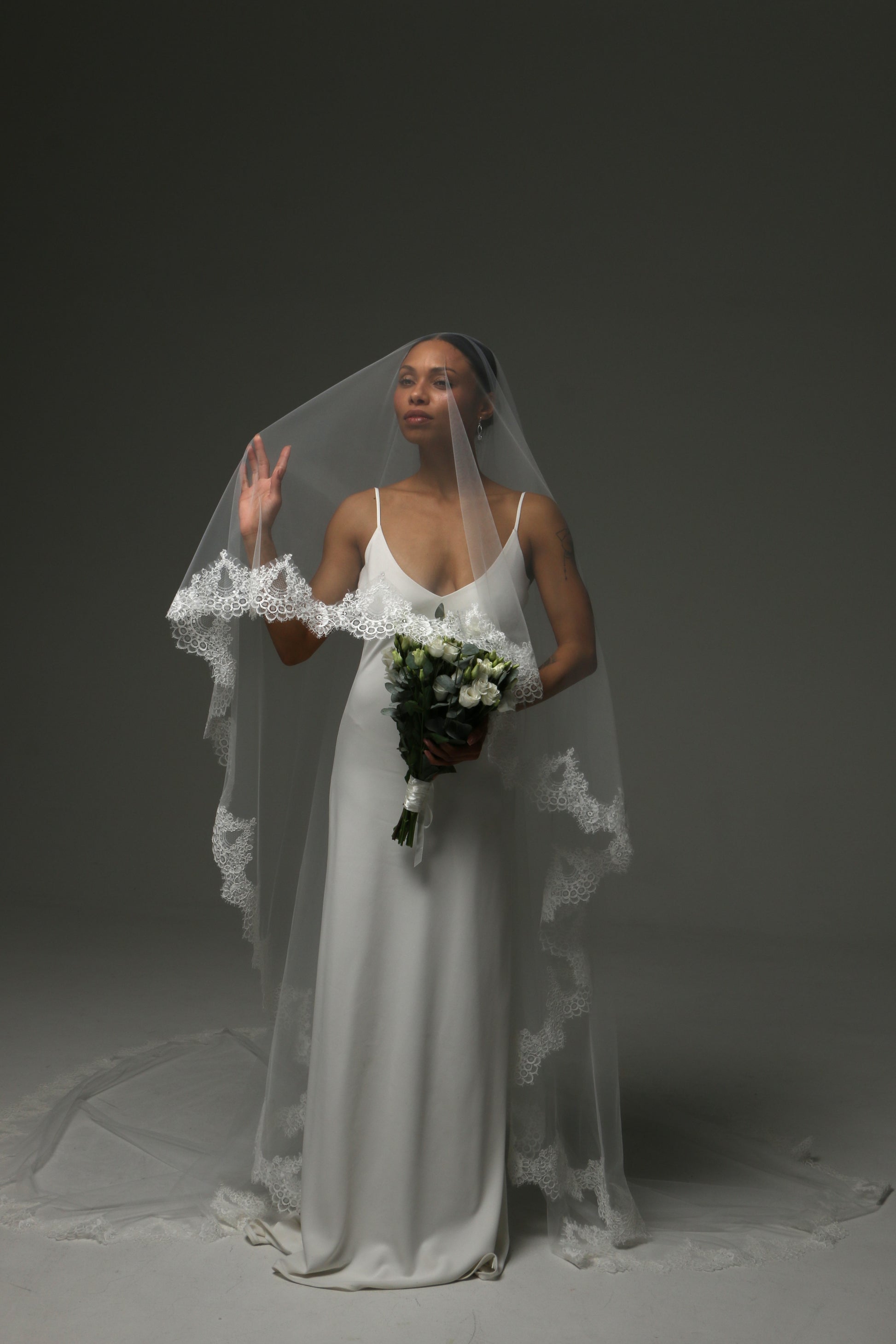 Traditional bridal veil with blusher and luxurious lace edge.