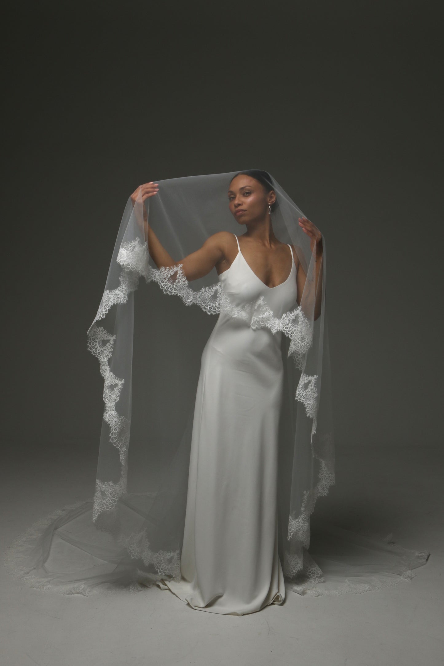 Two-tier bridal veil creating volume and romantic movement.