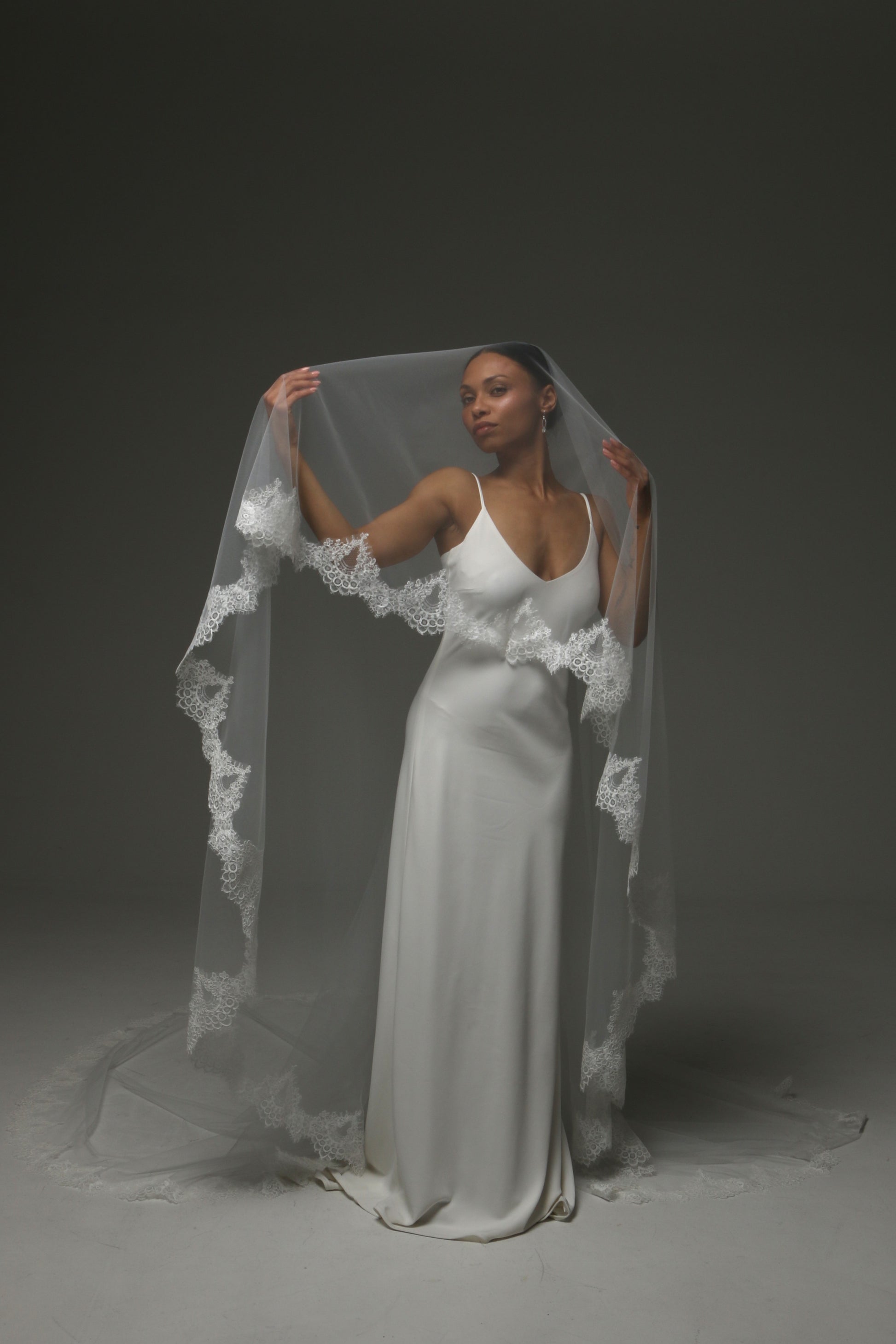 Two-tier bridal veil creating volume and romantic movement.