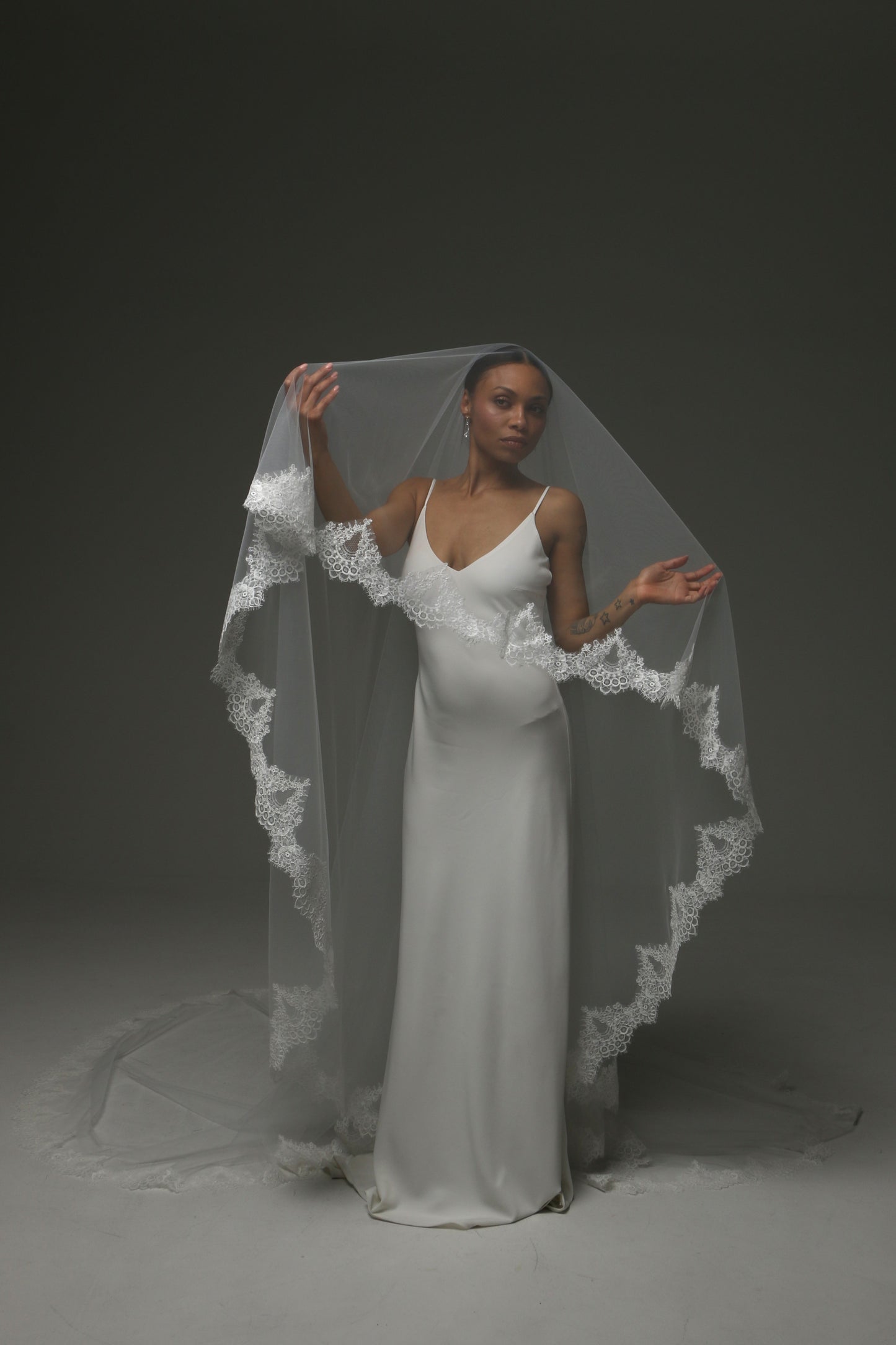 Elegant two-tier veil with wide lace edging throughout.