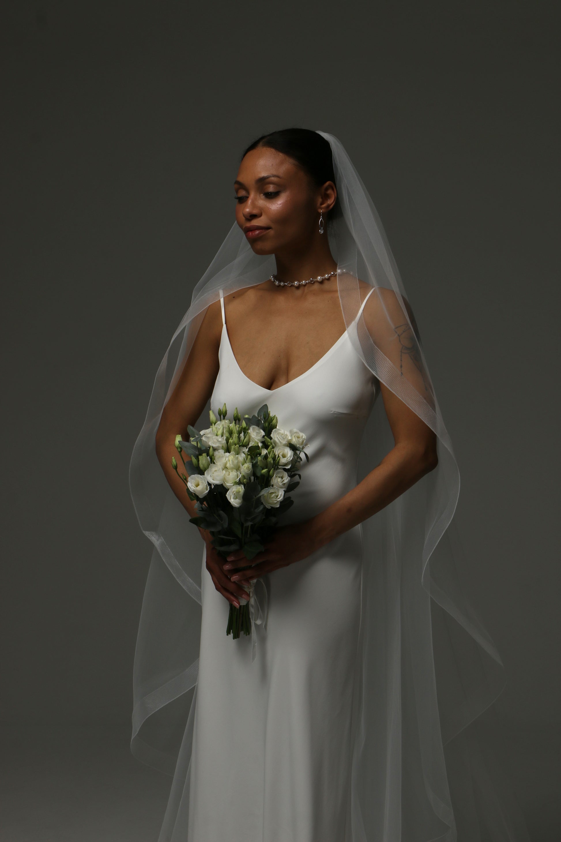 Cathedral-length veil with refined structure and airy drape.