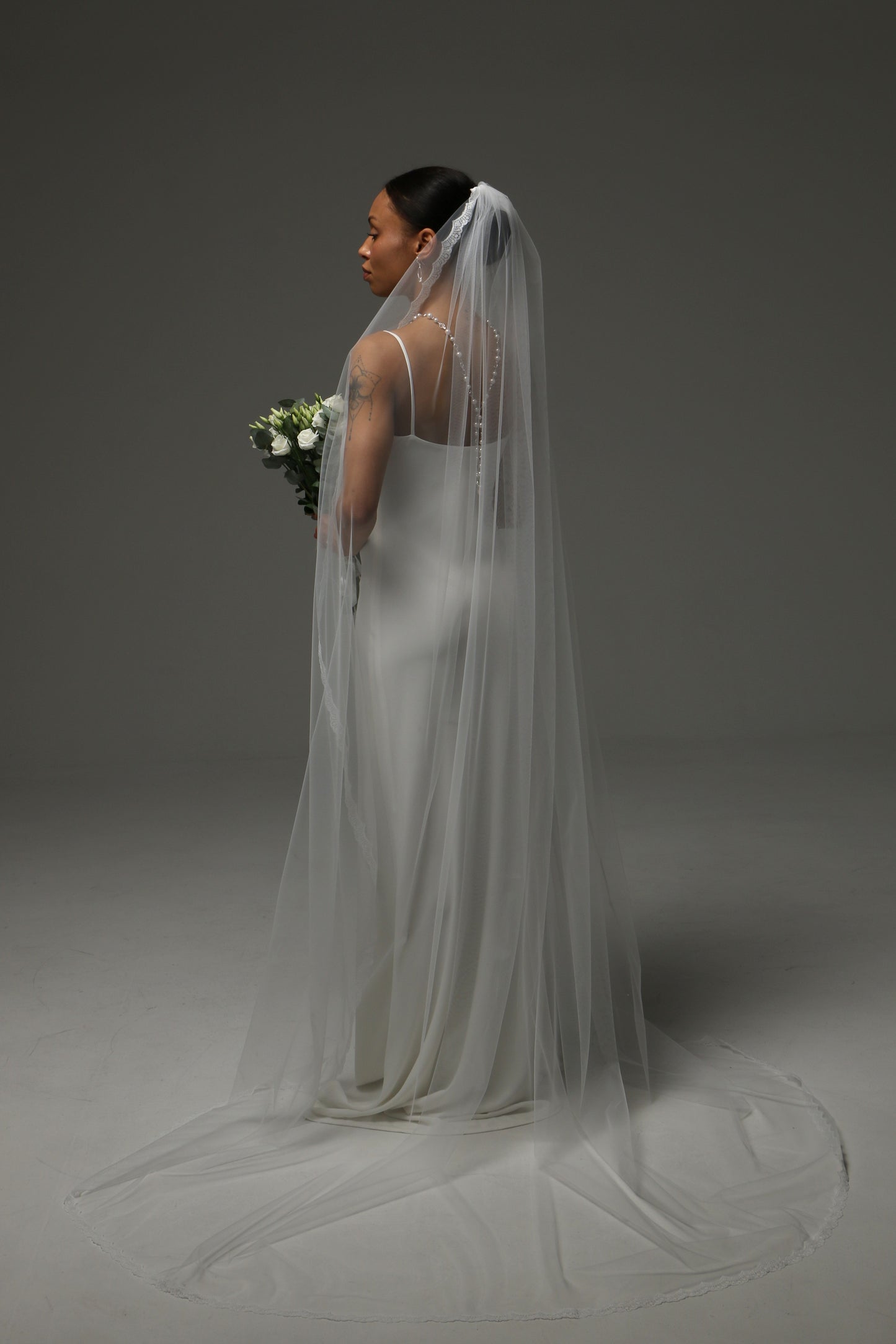 Timeless cathedral wedding veil with lightweight airy drape.