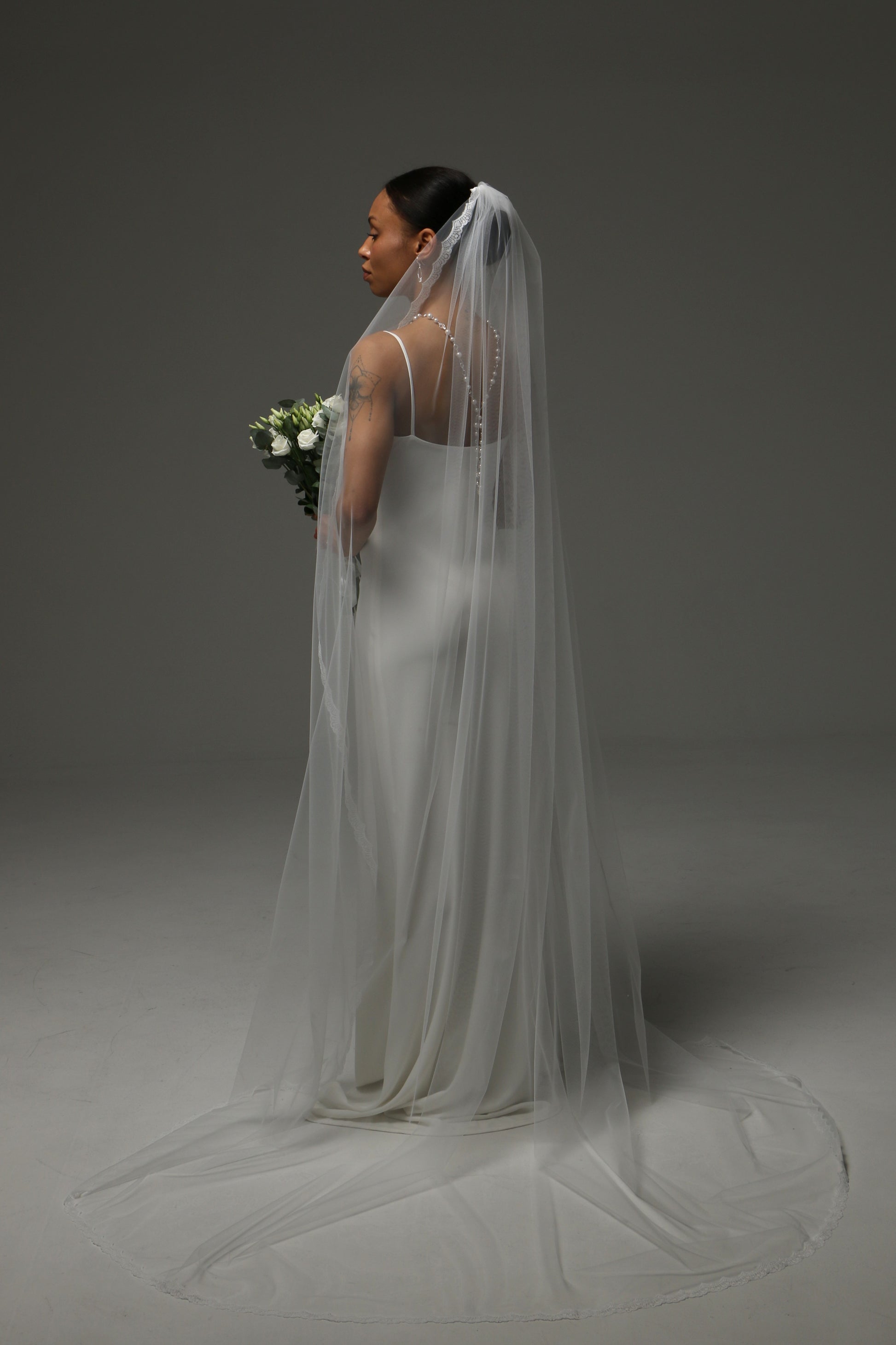 Timeless cathedral wedding veil with lightweight airy drape.