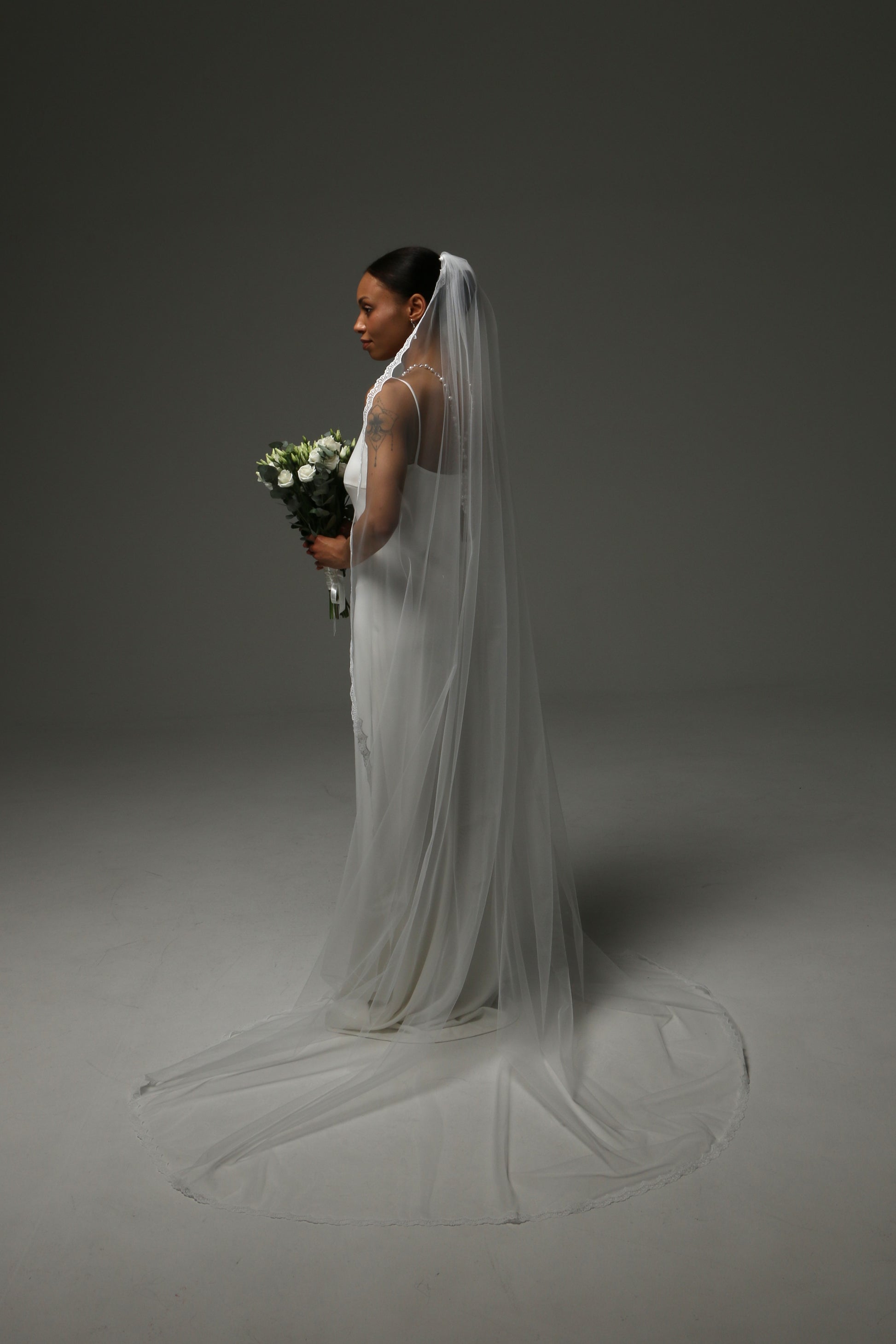 Handmade bridal veil with fine lace edge detailing.