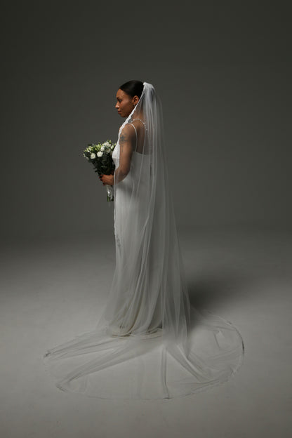 Handmade bridal veil with fine lace edge detailing.