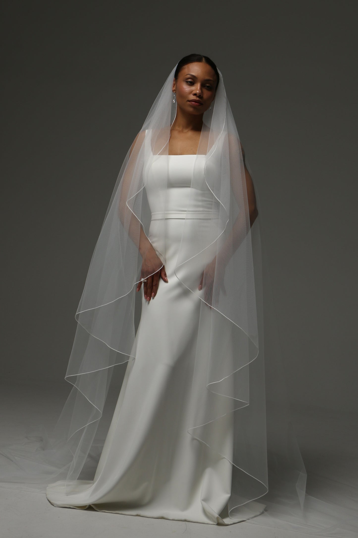 Soft illusion tulle cathedral veil with clean minimalist design.