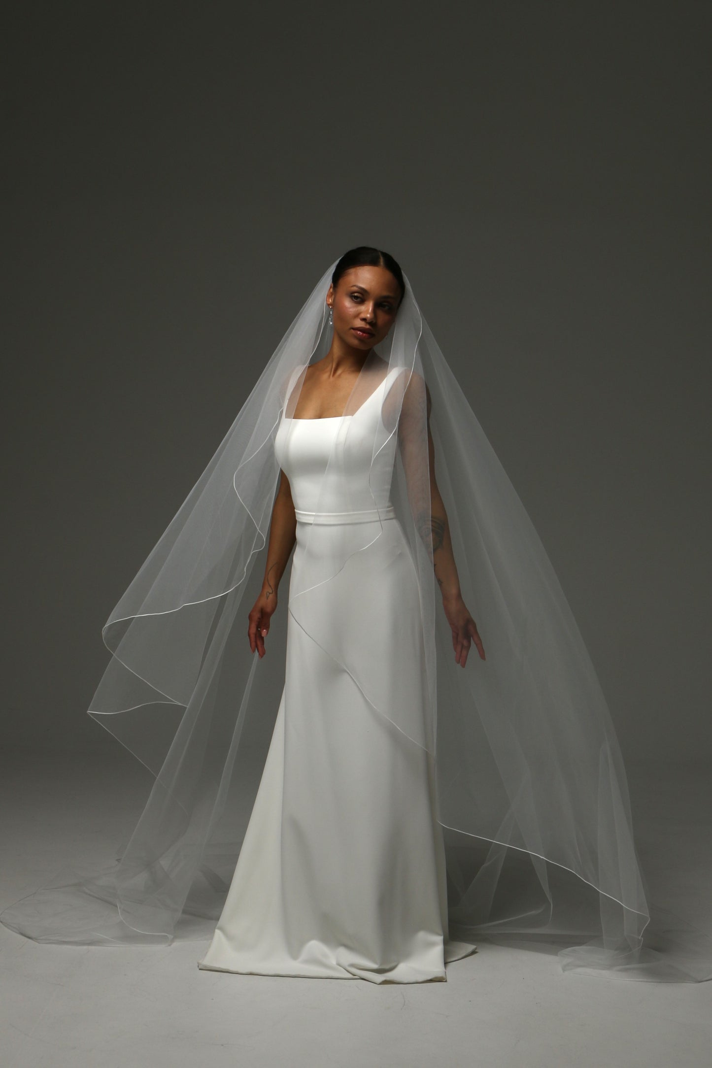 Handmade bridal veil featuring delicate pencil edge trim.