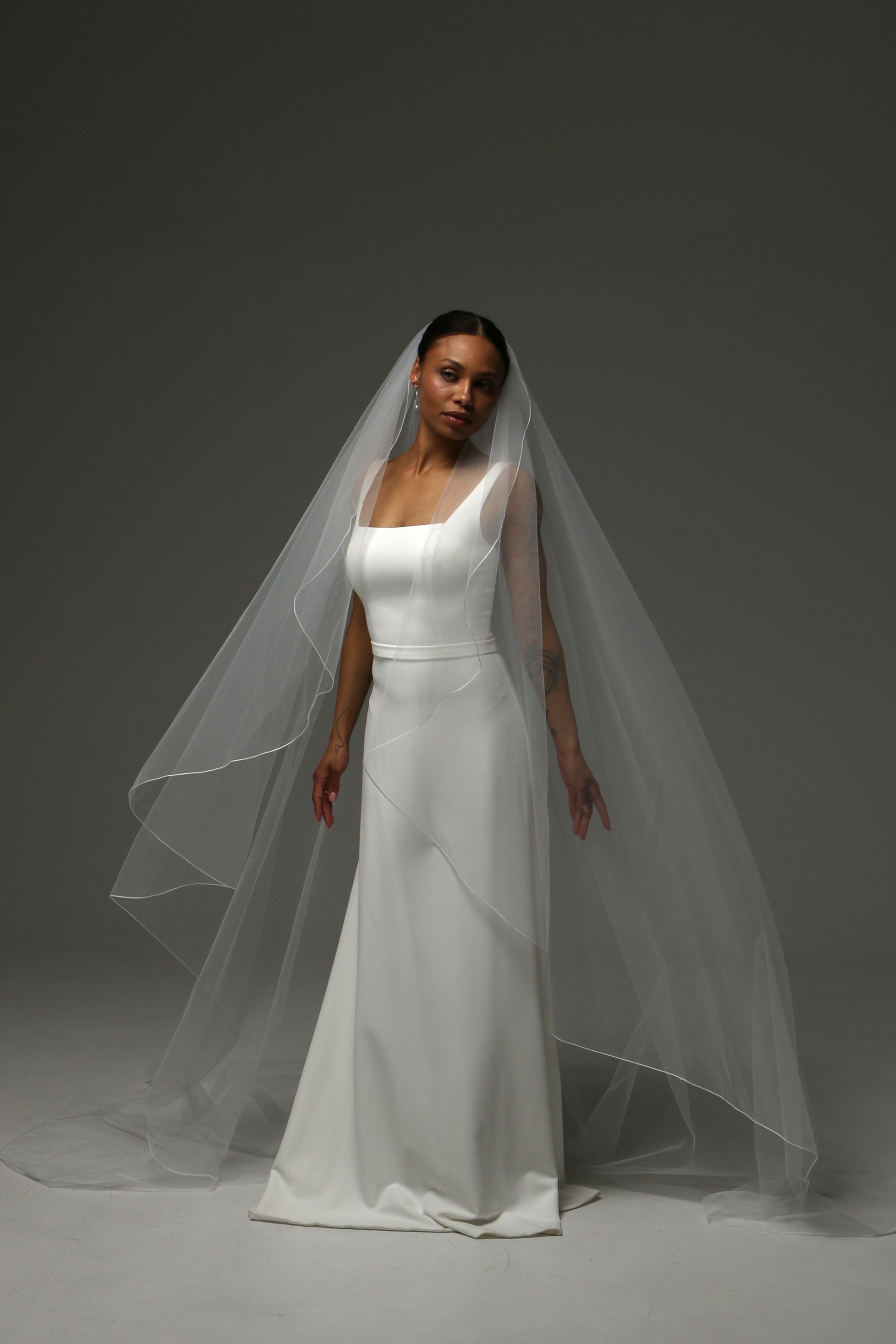 Handmade bridal veil featuring delicate pencil edge trim.