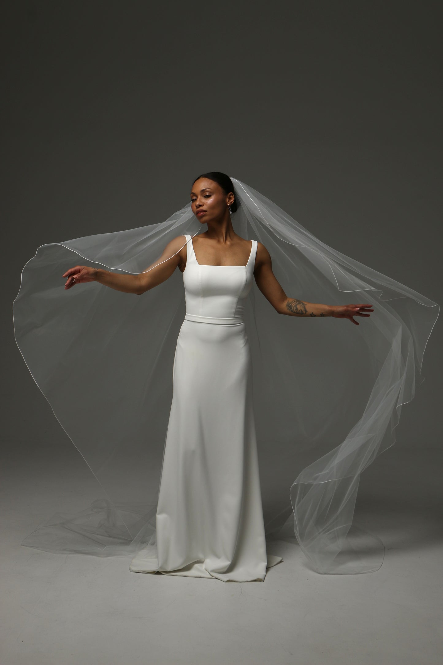 Cathedral-length wedding veil with lightweight flowing silhouette.