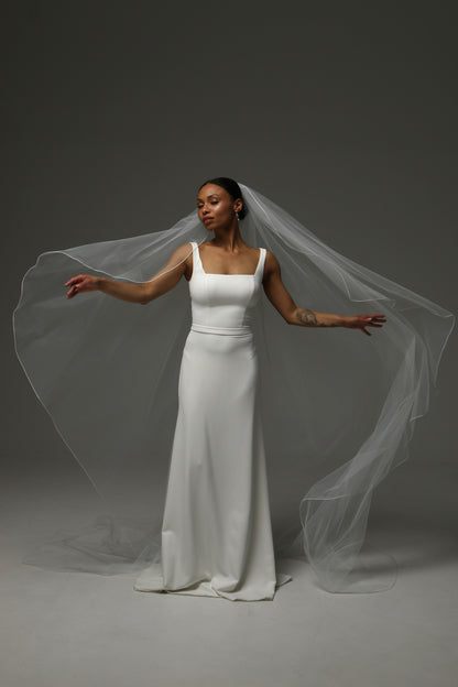 Cathedral-length wedding veil with lightweight flowing silhouette.