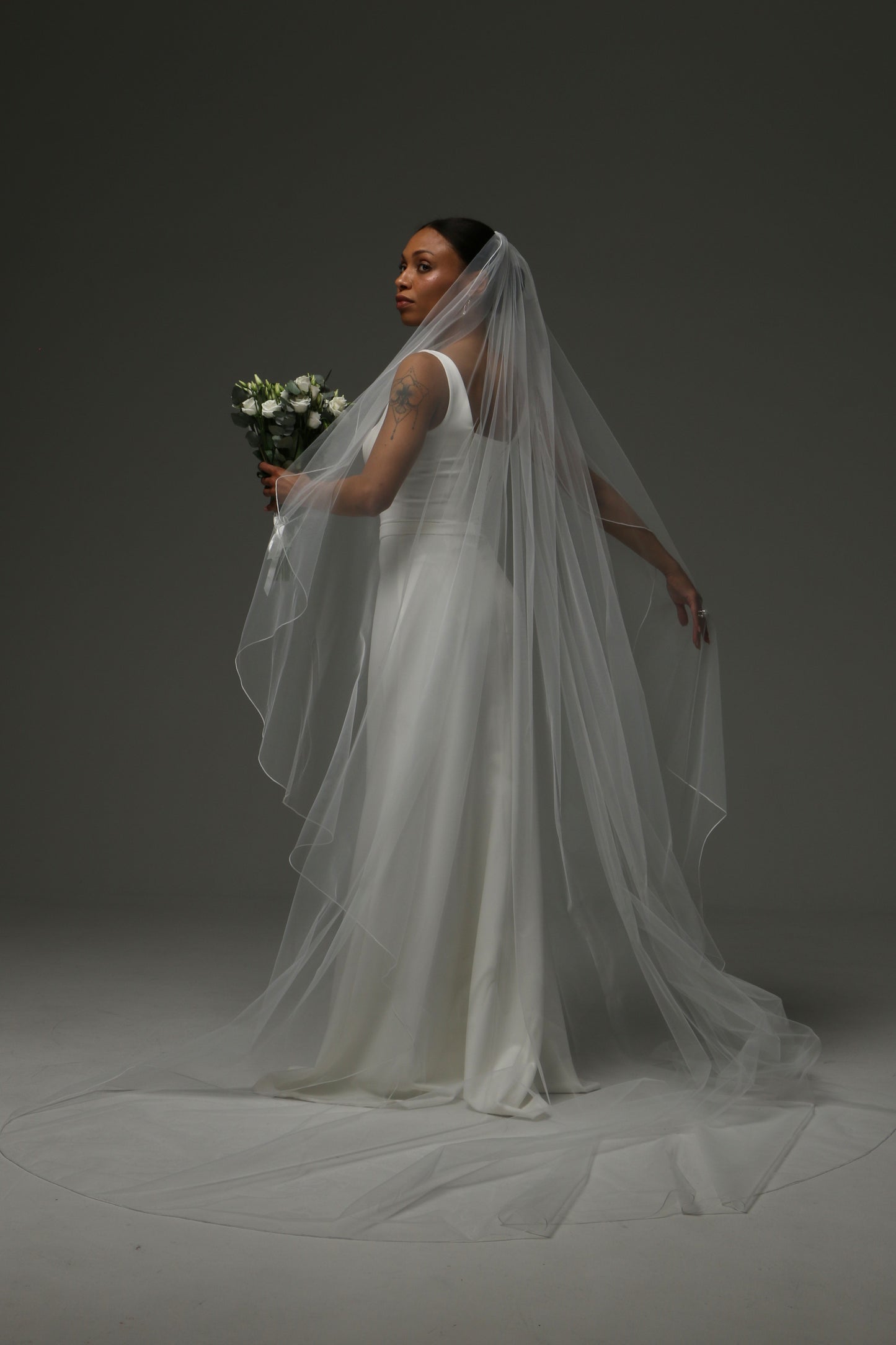 Soft illusion tulle veil designed for contemporary brides.