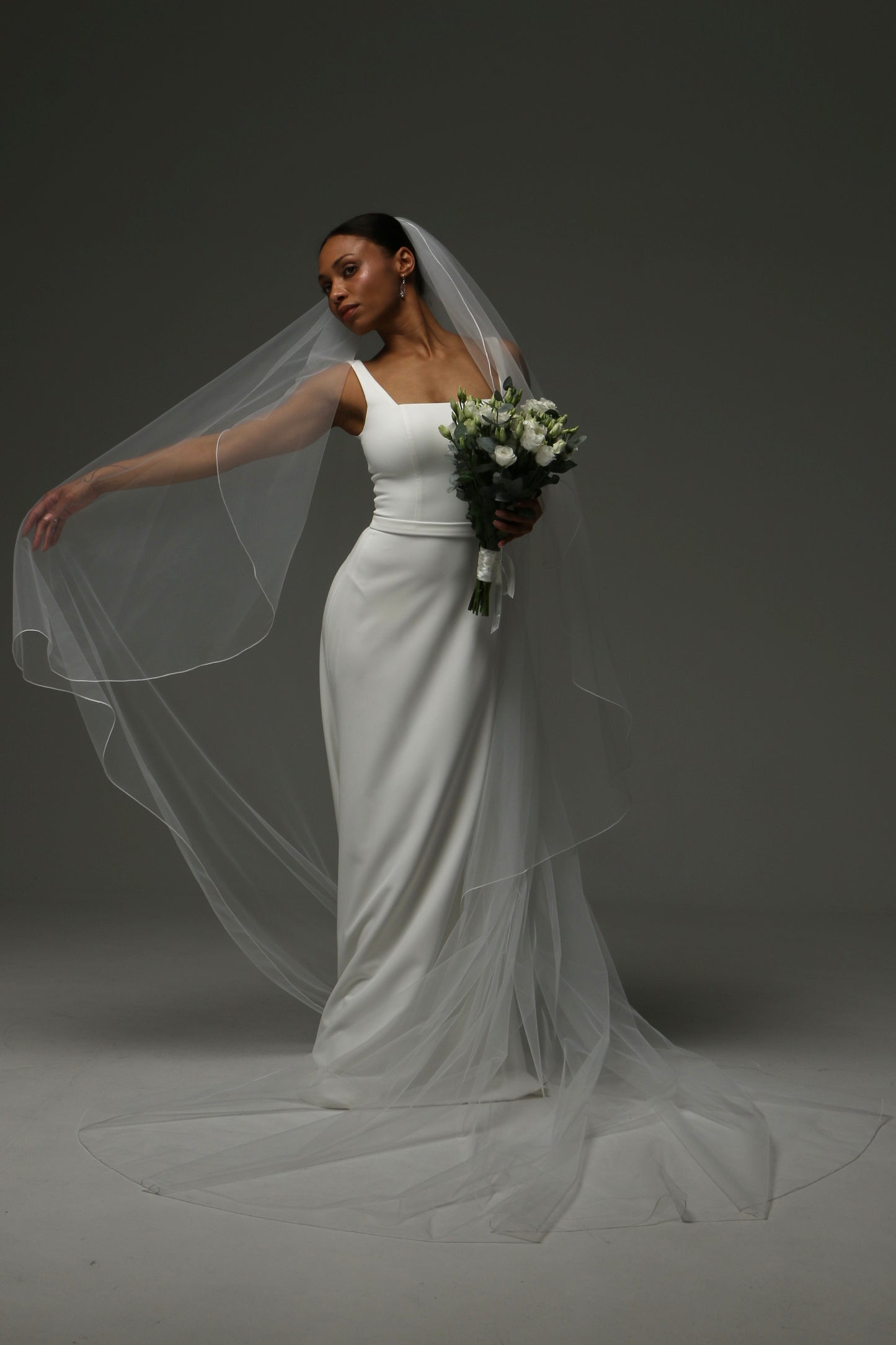 Elegant cathedral veil offering timeless and understated beauty.