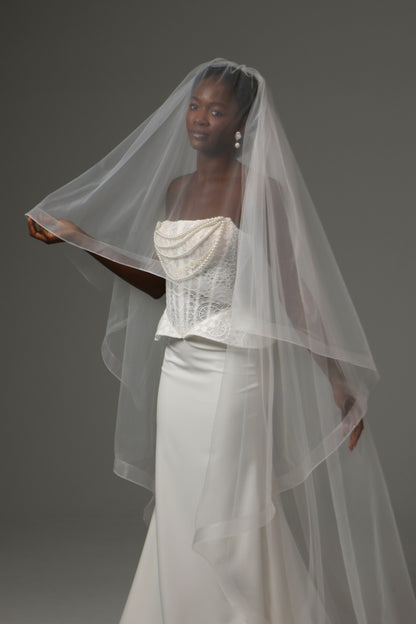 Cathedral-length wedding veil with elegant blusher layer.