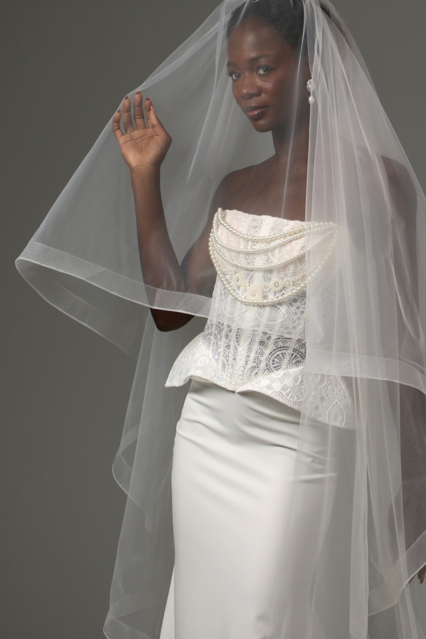 Modern bridal veil with horsehair edge creating soft waves.
