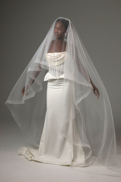 Lightweight wedding veil with structured horsehair border.