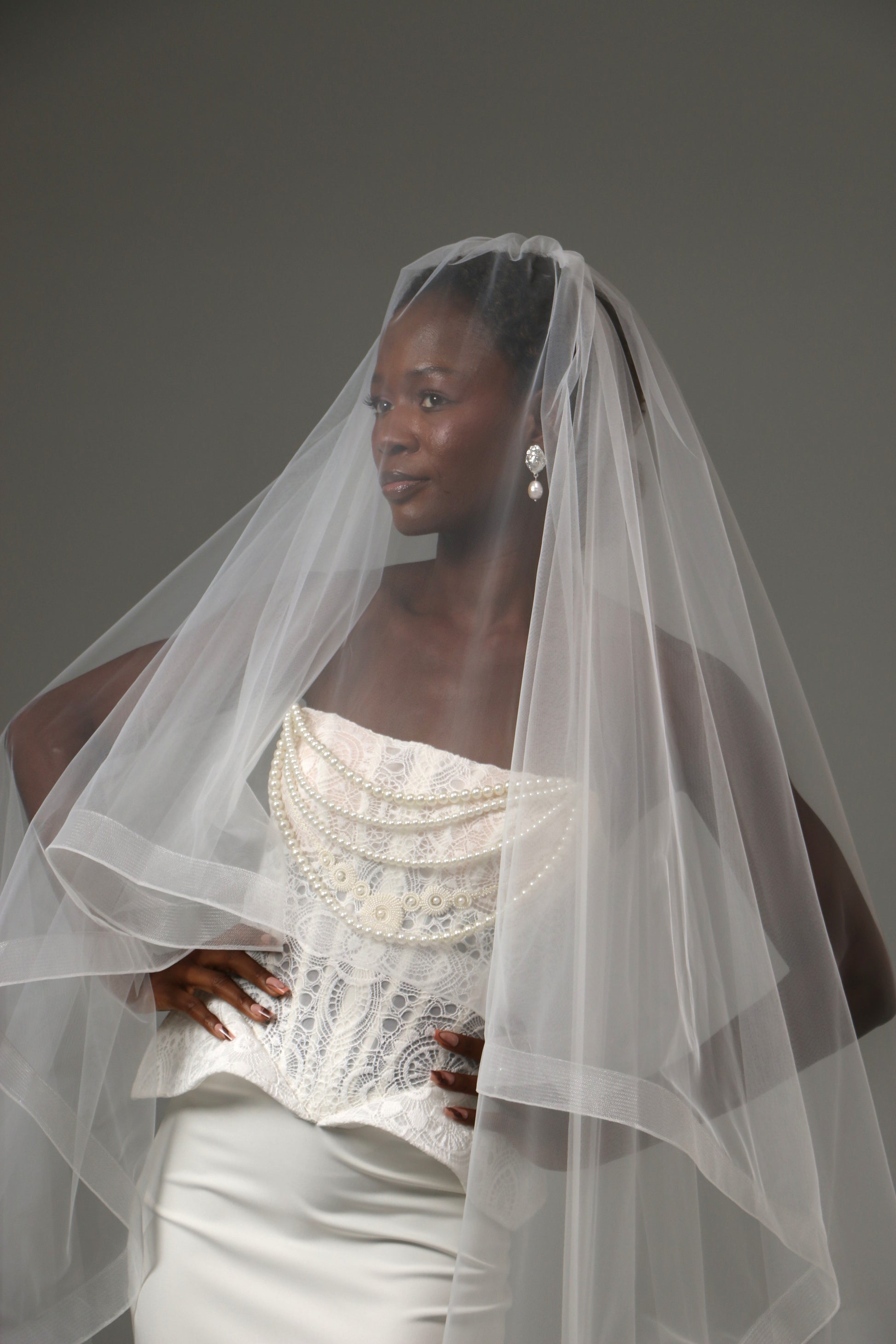 Traditional blusher veil paired with a contemporary wedding gown.