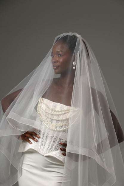 Traditional blusher veil paired with a contemporary wedding gown.