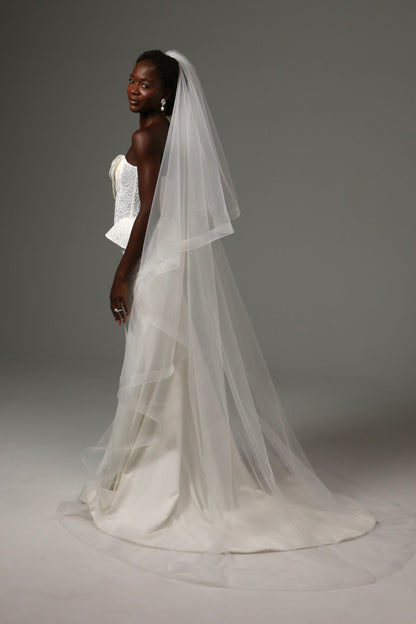 Elegant cathedral veil with dramatic volume and movement.