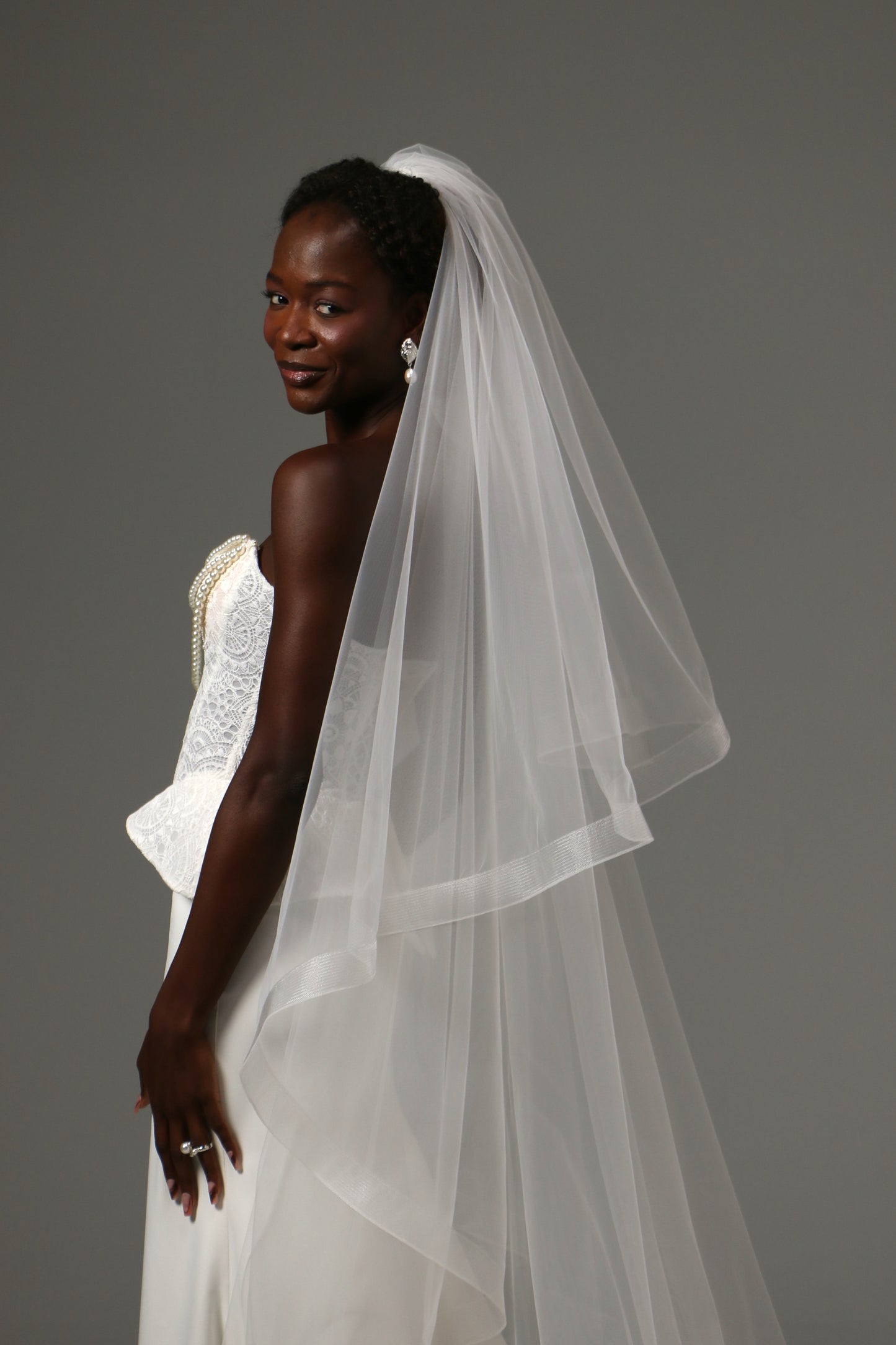 Cathedral bridal veil crafted from soft illusion tulle.