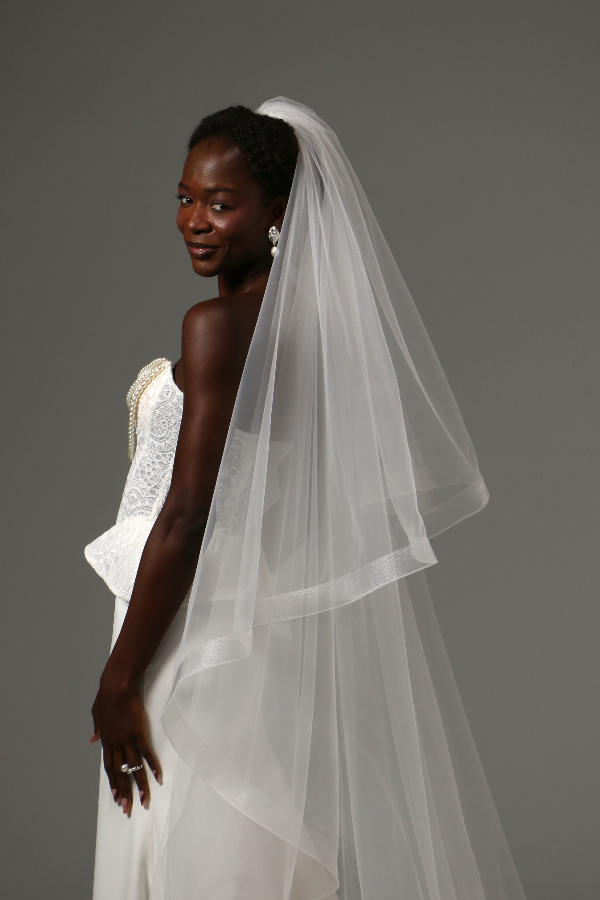Cathedral bridal veil crafted from soft illusion tulle.