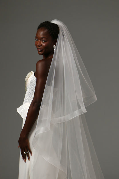 Cathedral bridal veil crafted from soft illusion tulle.