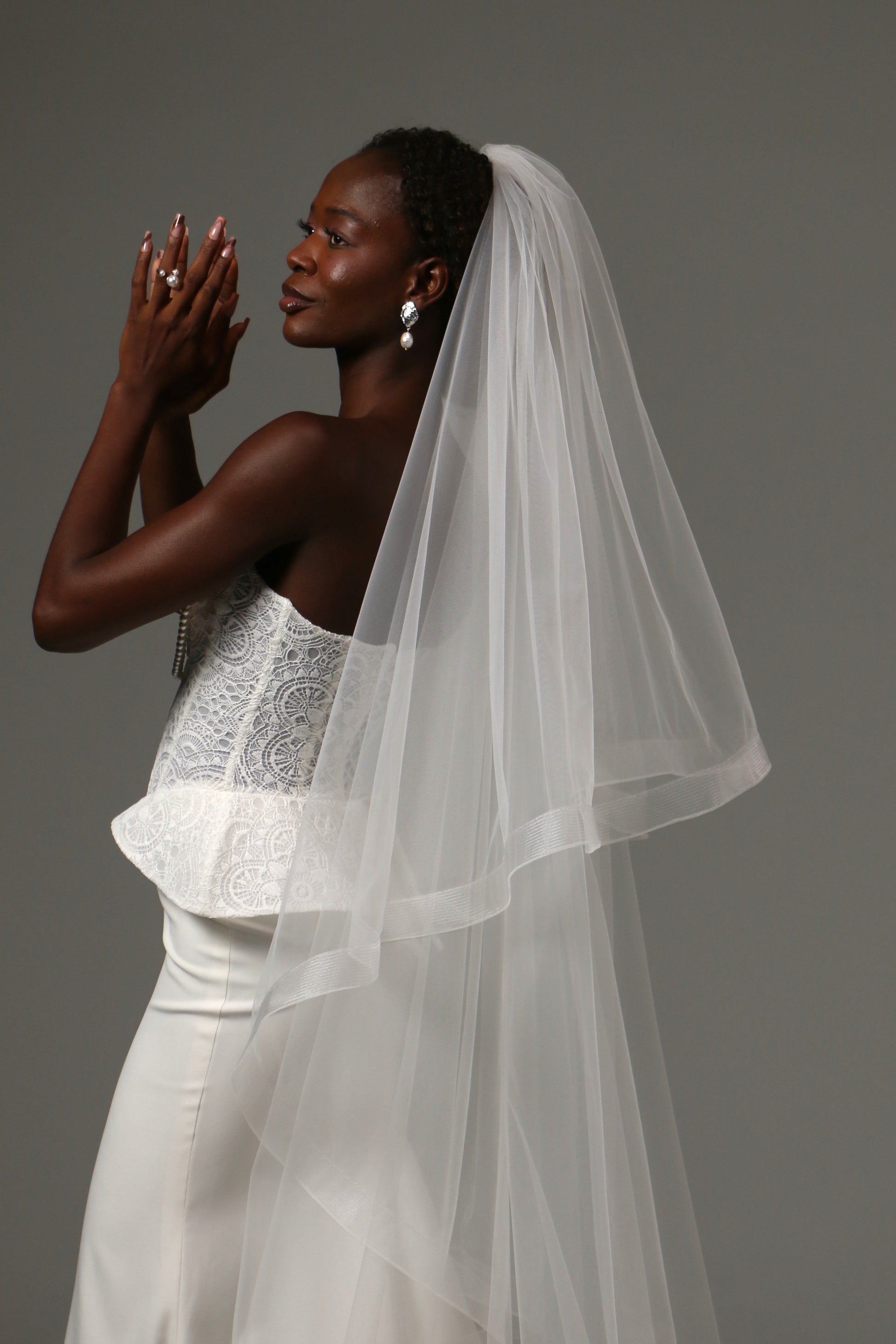 Handmade cathedral veil featuring horsehair trim detailing.
