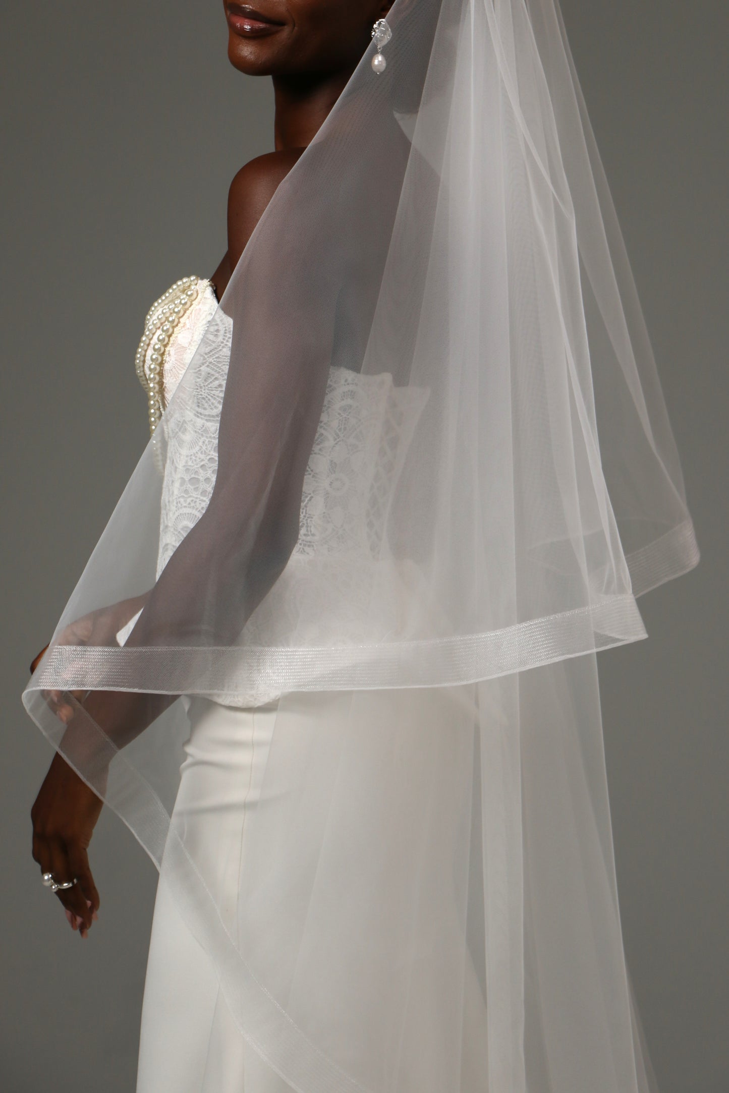 Romantic bridal accessory with blusher and cathedral length.