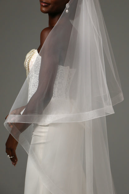 Romantic bridal accessory with blusher and cathedral length.