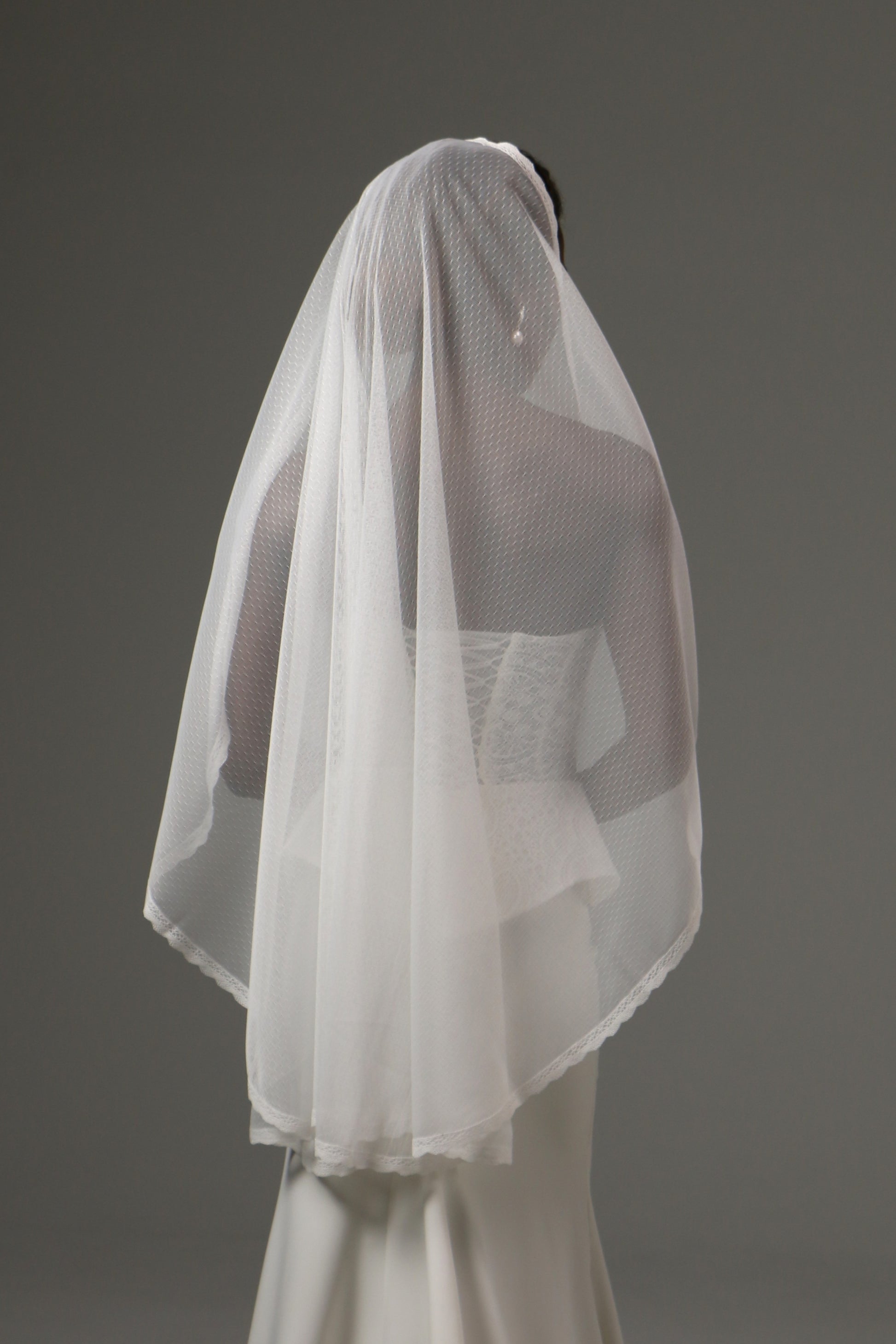 Modern bridal veil designed for romantic wedding styling.