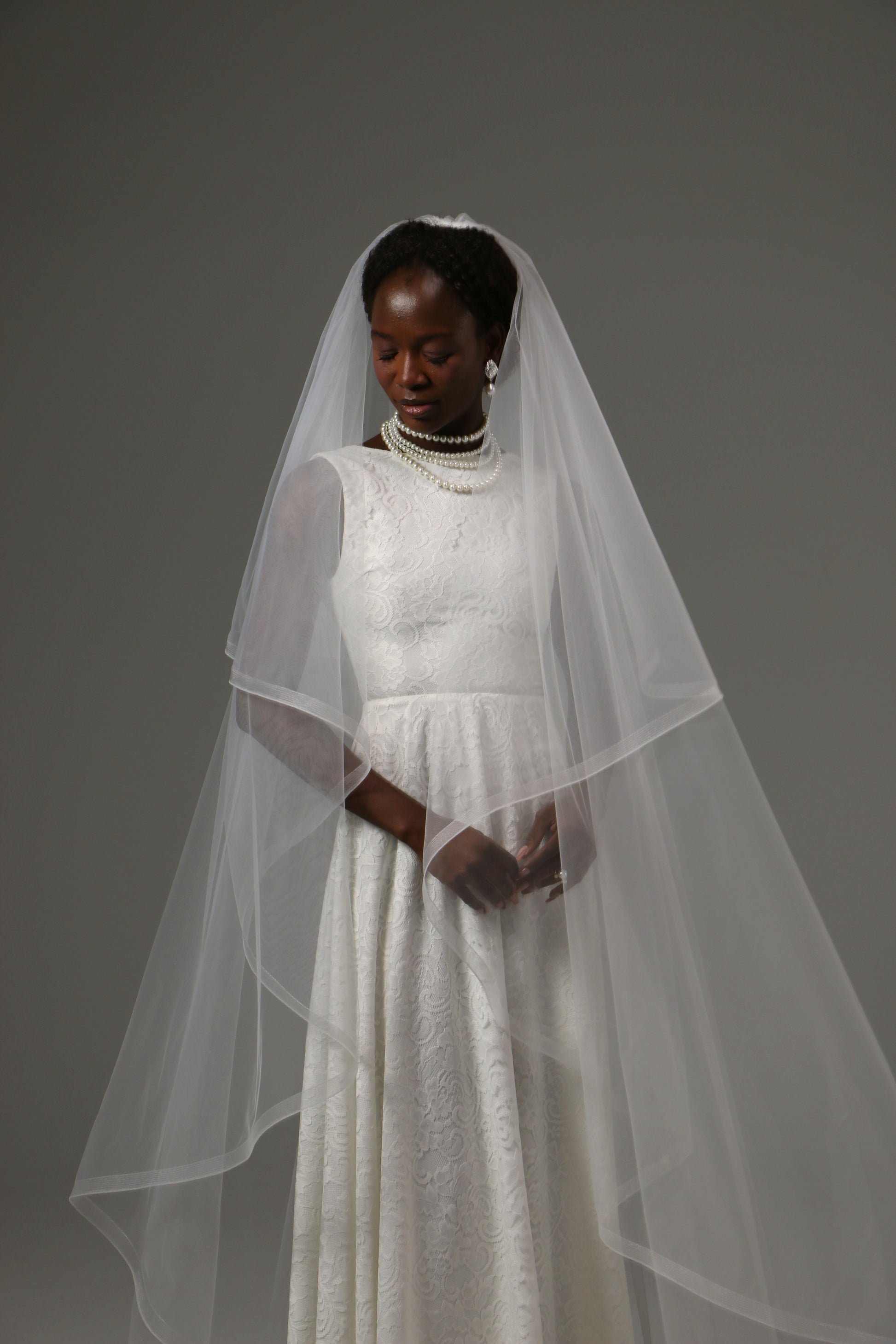 Soft tulle veil with modern horsehair edge finish.