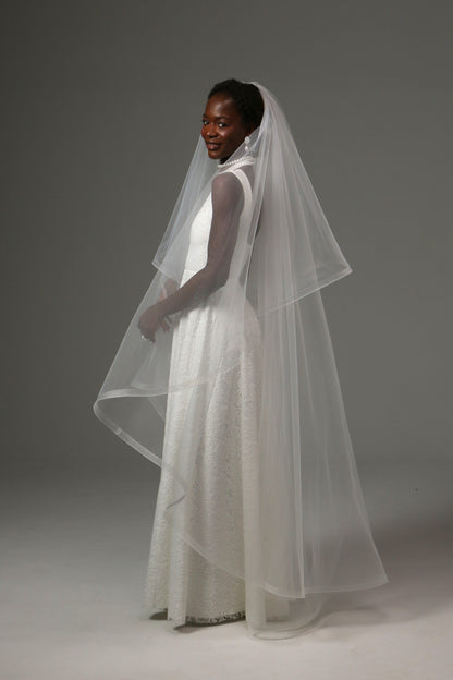 Two-tier wedding veil designed for romantic ceremonies.
