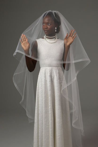 Soft illusion tulle veil with airy and lightweight construction.
