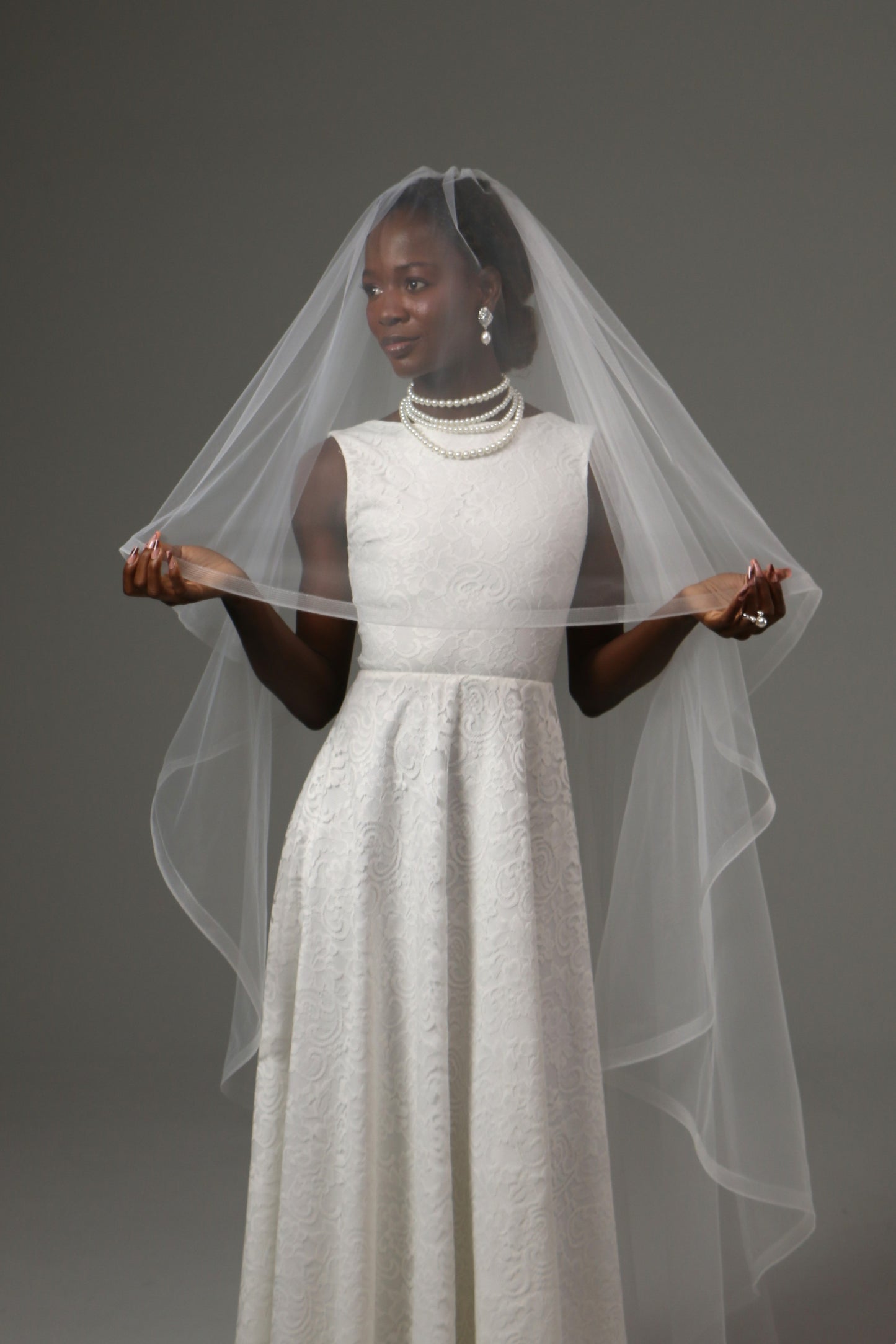 Waltz-length veil offering volume without cathedral length.