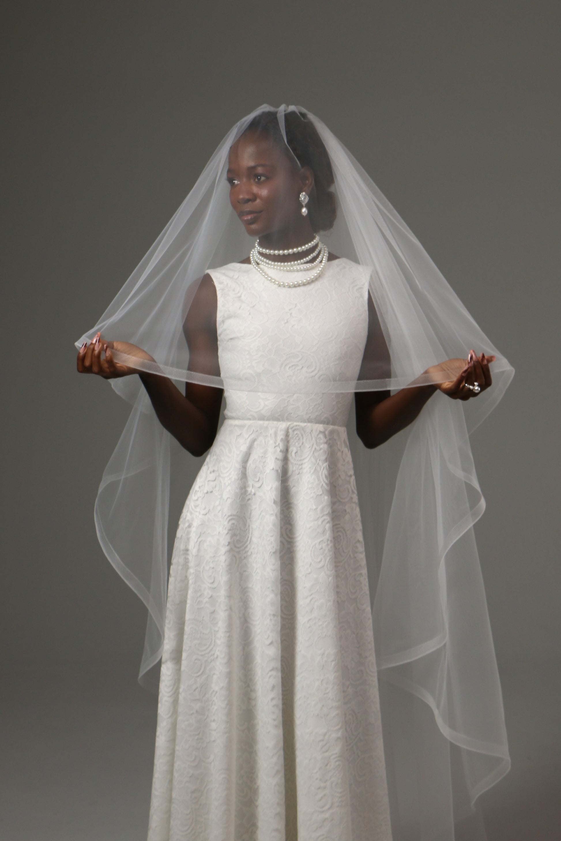 Waltz-length veil offering volume without cathedral length.