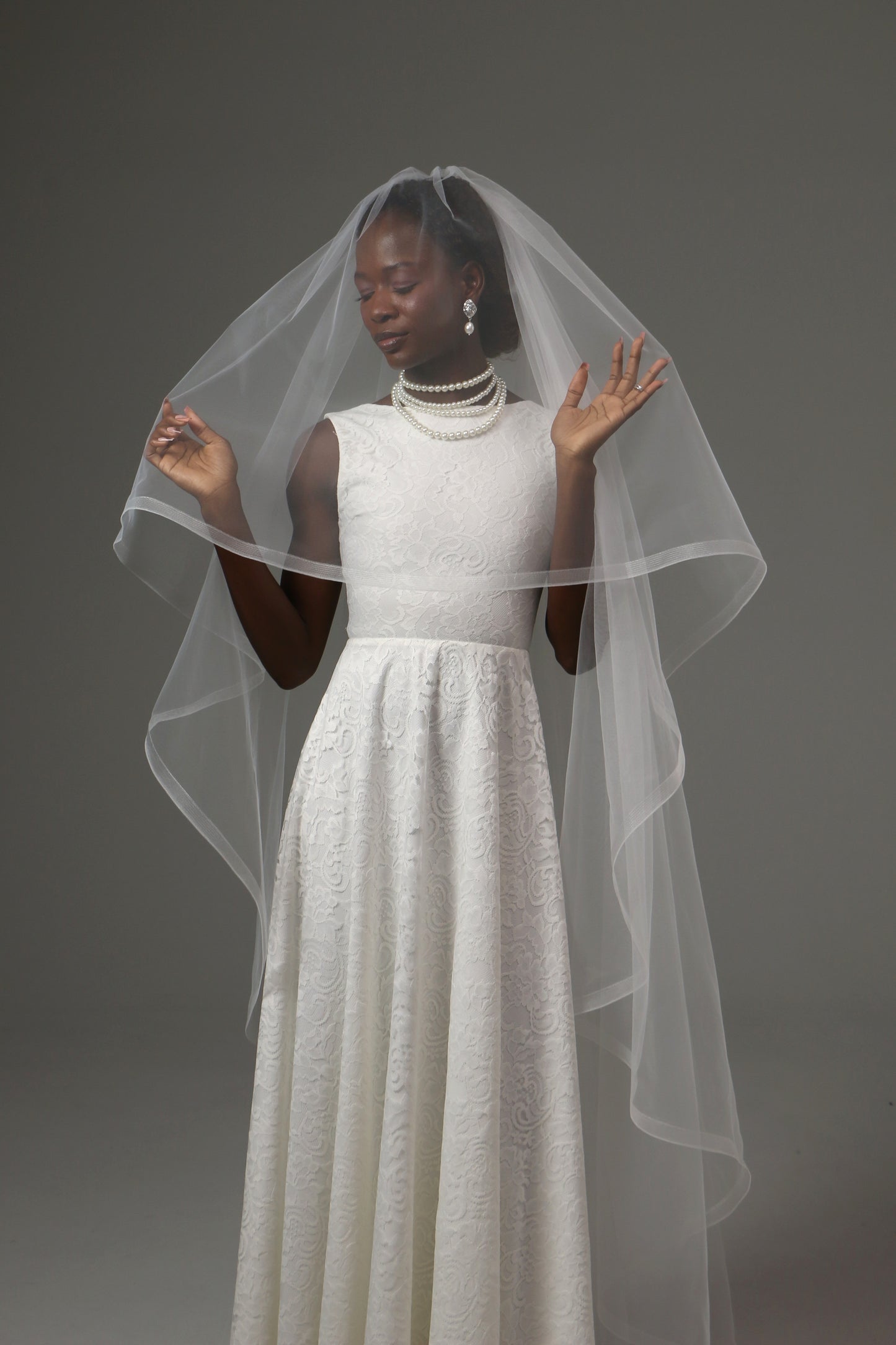 Handmade wedding veil with blusher and horsehair trim detail.