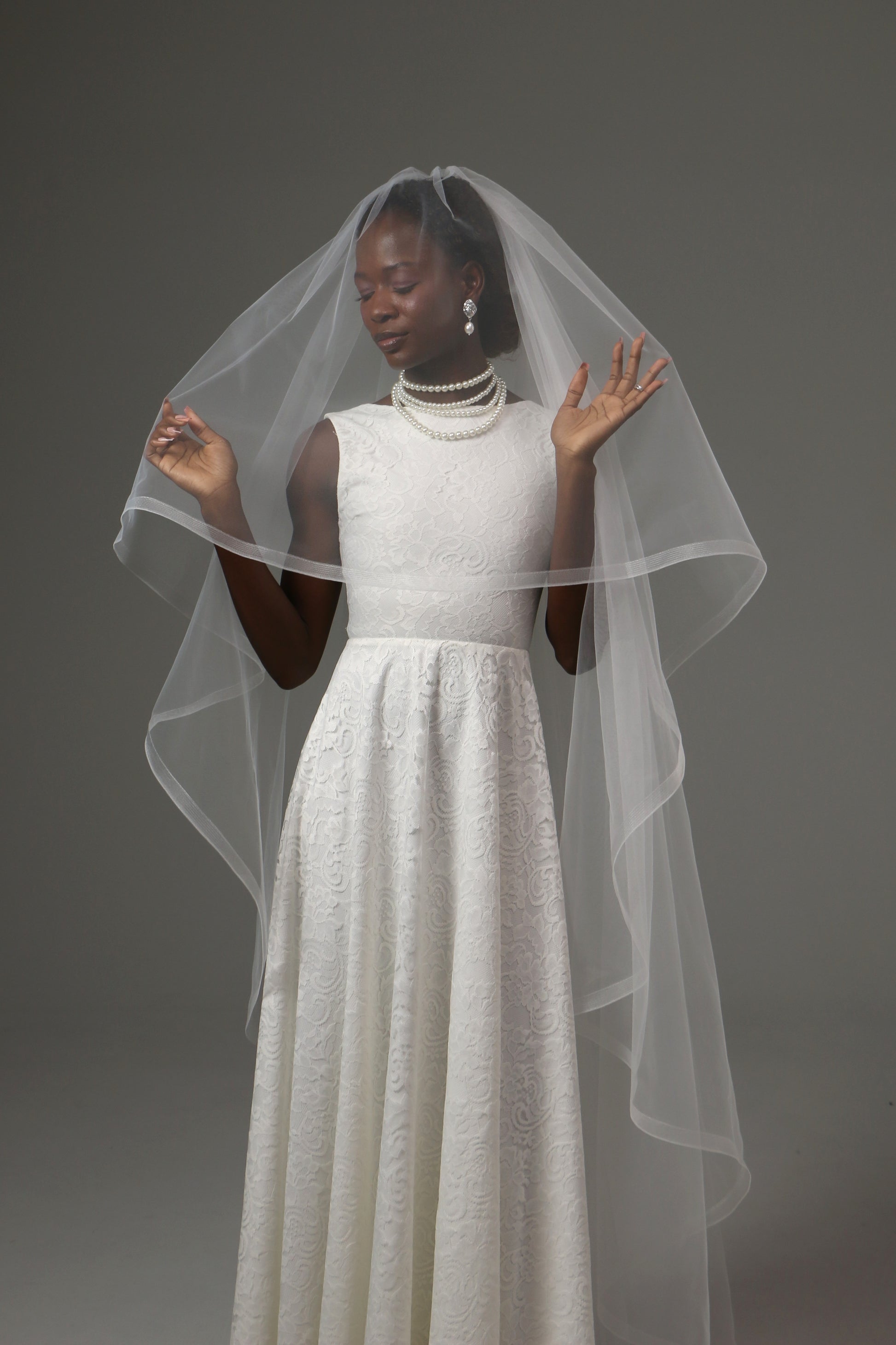 Handmade wedding veil with blusher and horsehair trim detail.