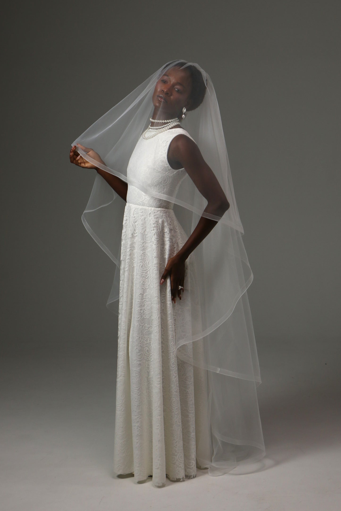 Romantic bridal veil with flowing curves and soft movement.