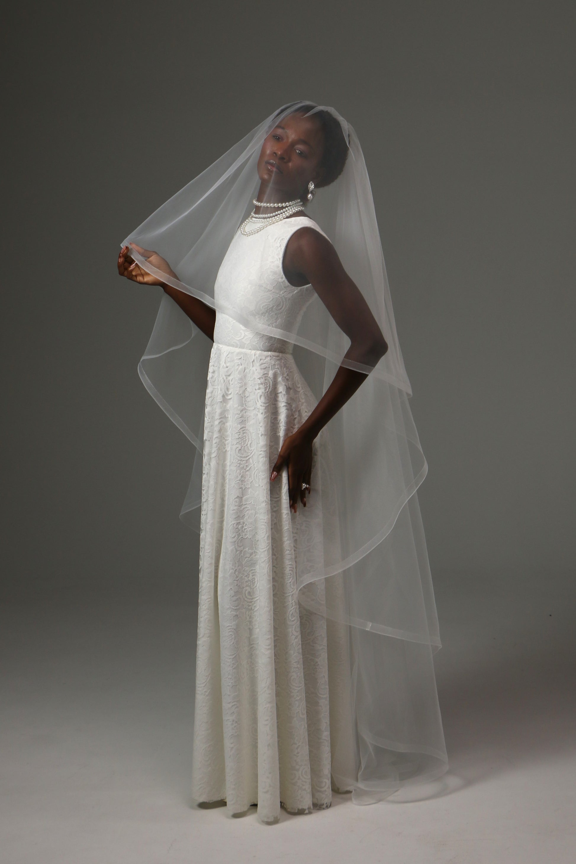 Romantic bridal veil with flowing curves and soft movement.