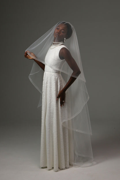 Romantic bridal veil with flowing curves and soft movement.