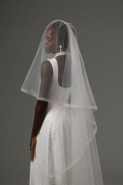 Elegant two-tier veil designed for minimalist wedding styling.
