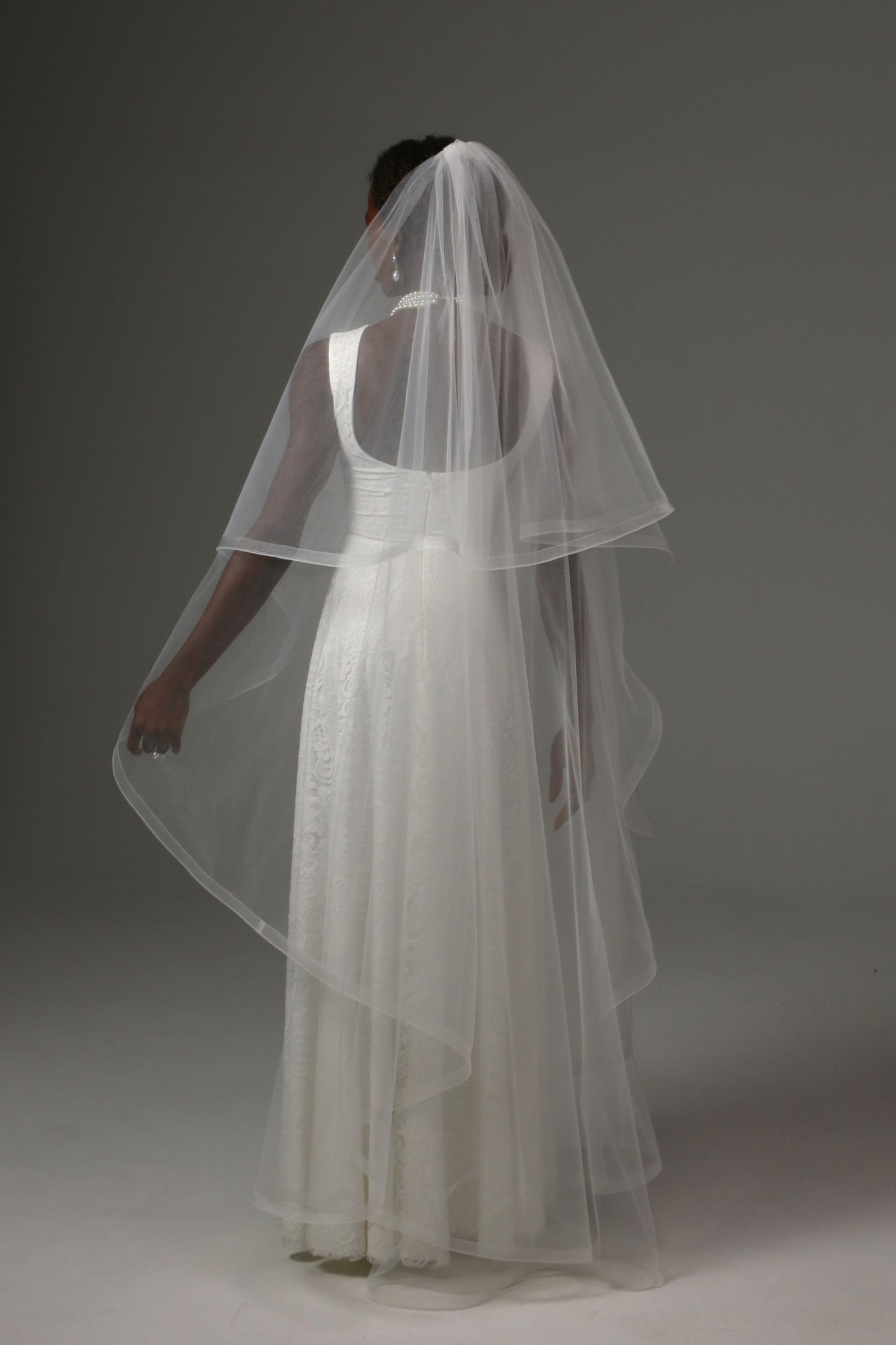 Two-tier waltz bridal veil combining timeless elegance and modern sophistication.